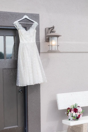 Wedding dress hanging up during details photos at an Omaha wedding