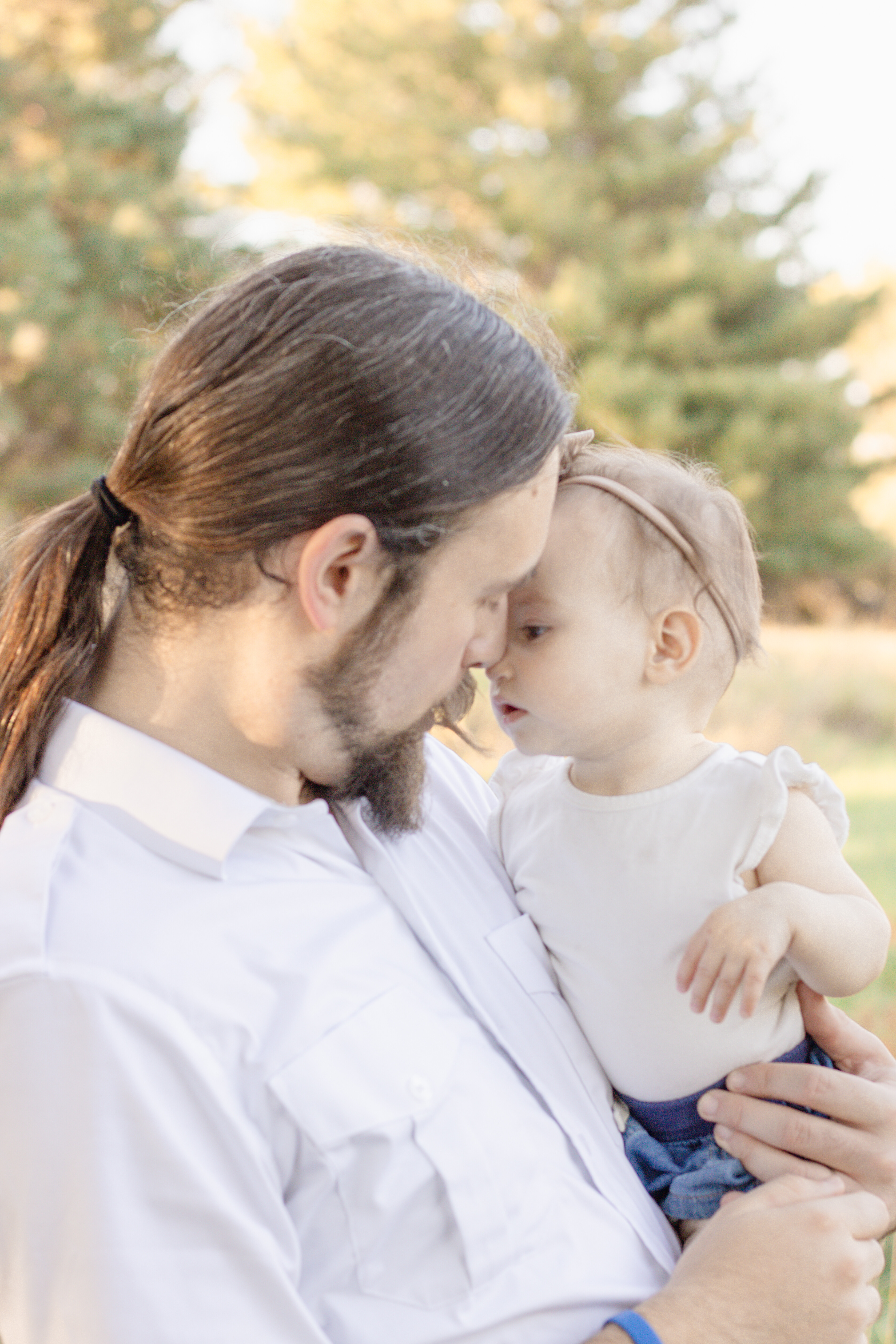 Dad smiling at his baby girl during their Omaha family session